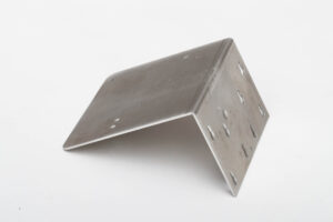 Metal rectangle that has been bent into a 90 degree angle by forming machine